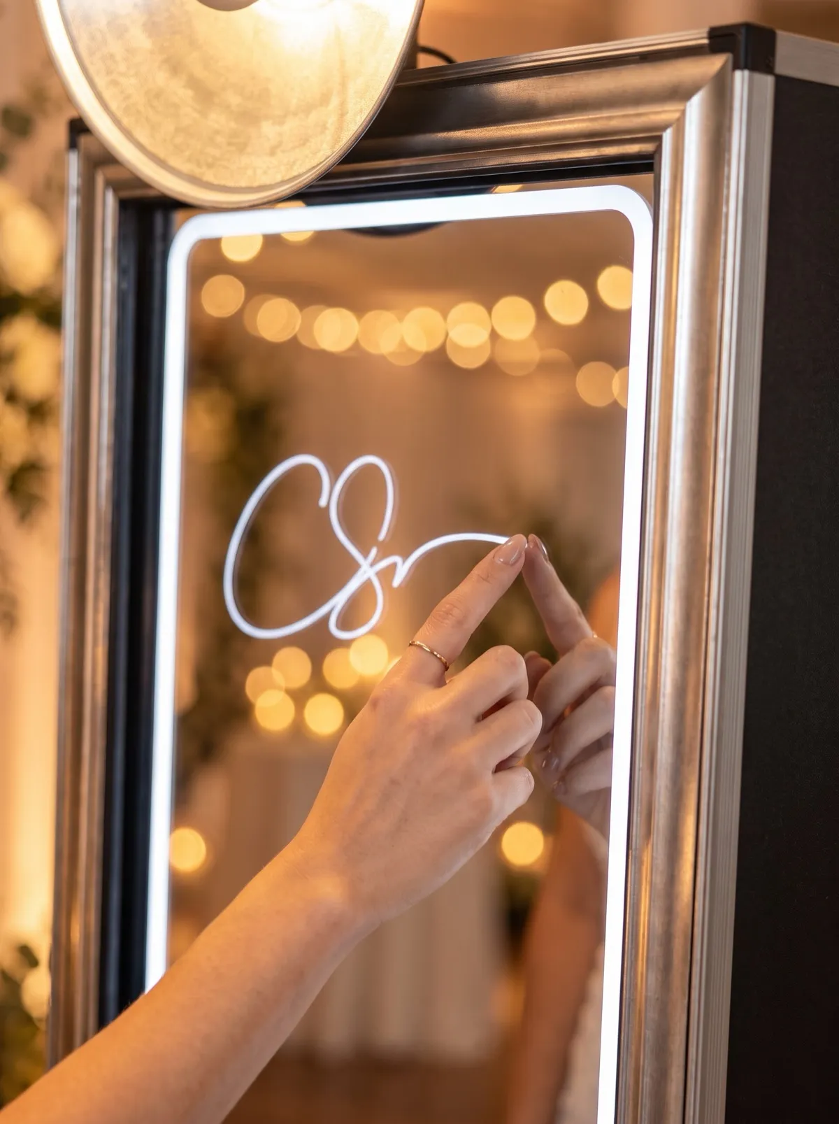 Signature drawn with a finger on the mirror surface